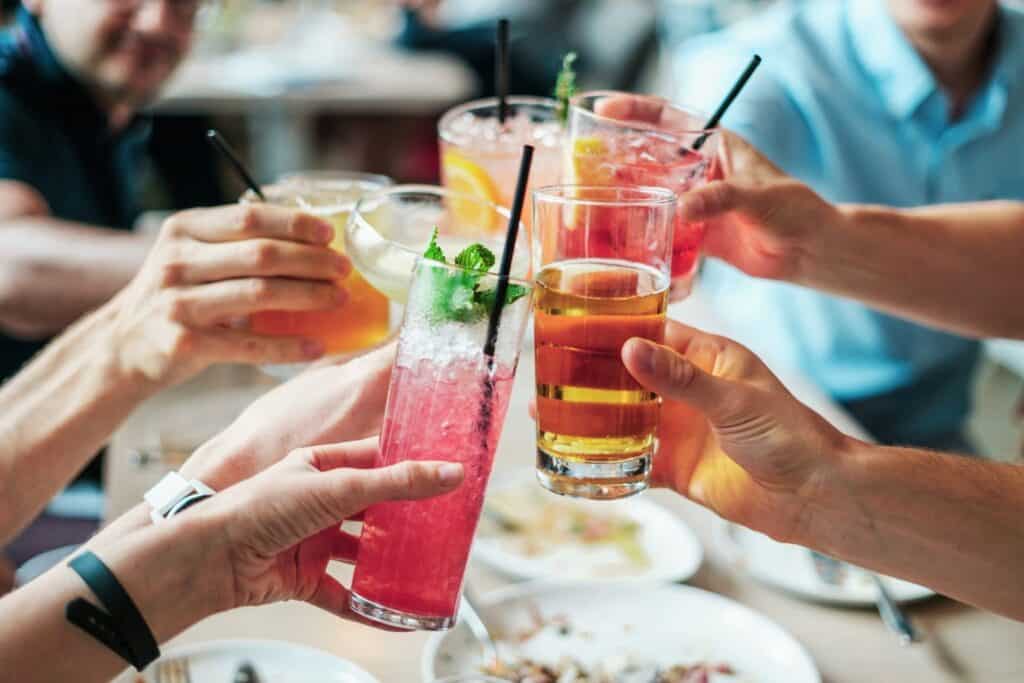 Close up image of people drinking cocktails