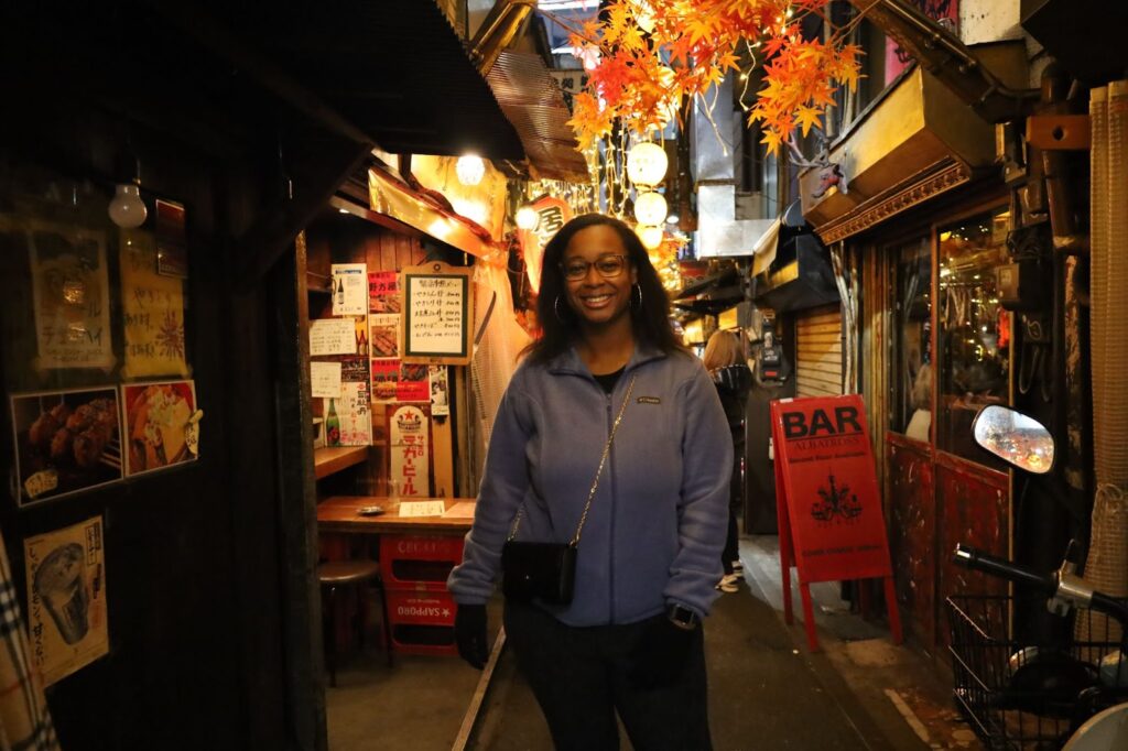 Explore Shinjuku Like A Local: A Happy Flip Japan Guide 1-Day Tokyo Tour Customer at Omoide Yokocho (Photo by Flip Japan Guide)