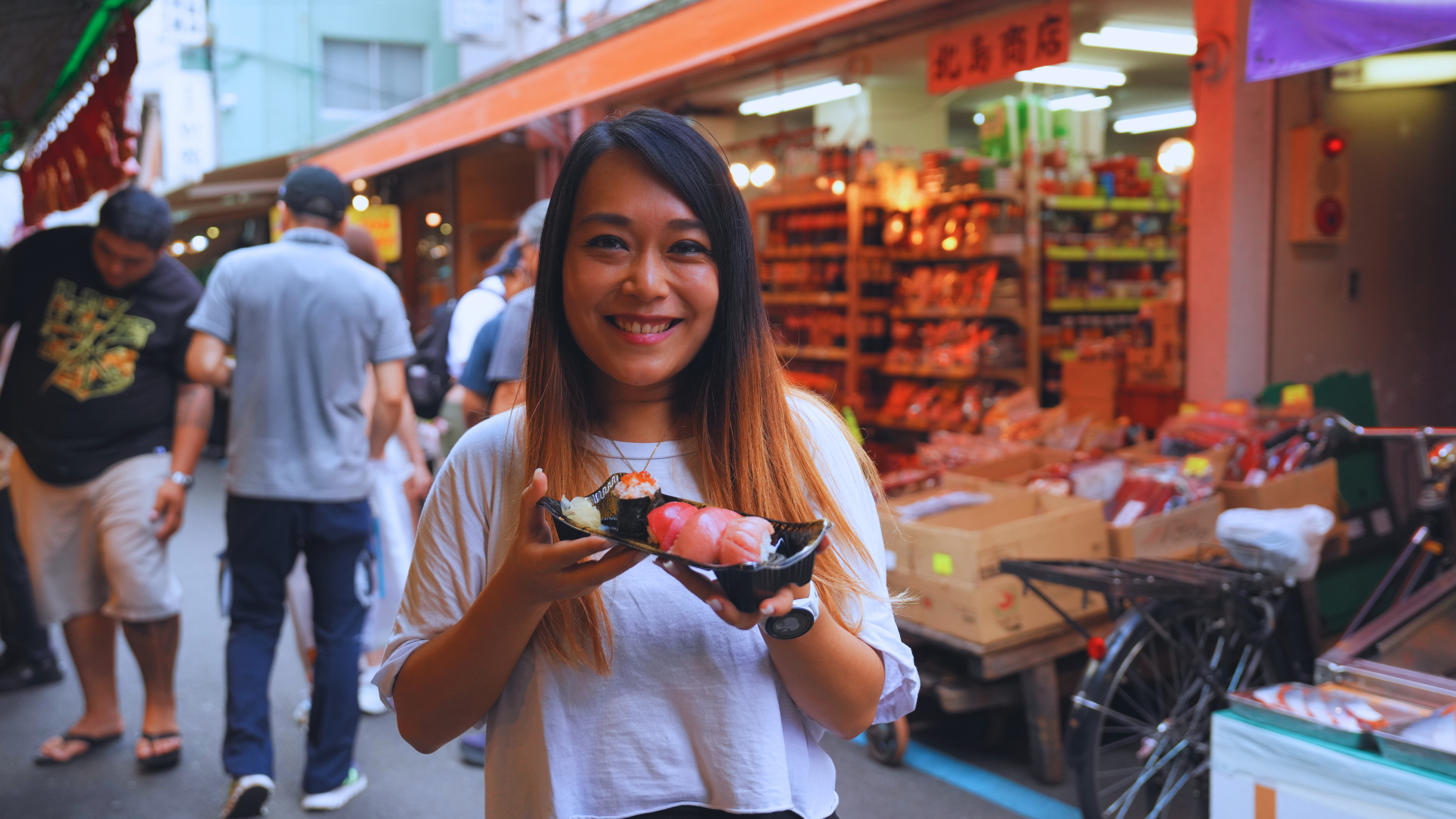 Flip Japan photo of a woman eating sushi, a unique things to do in Tokyo food and drink