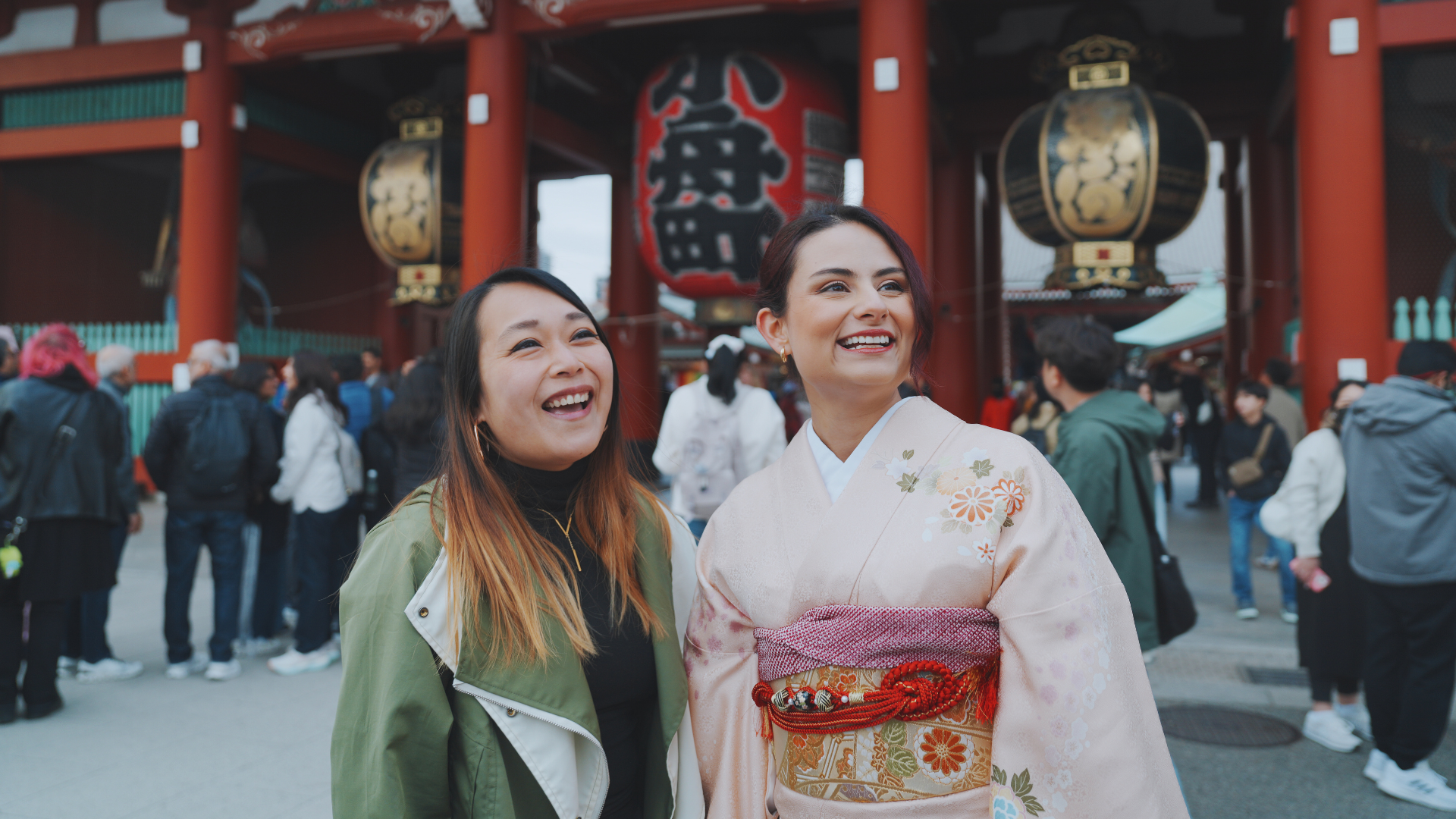 Flip Japan photo of two women at senso-ji, one in normal clothes, the other in kimono for the post What to Wear in Japan cover photo