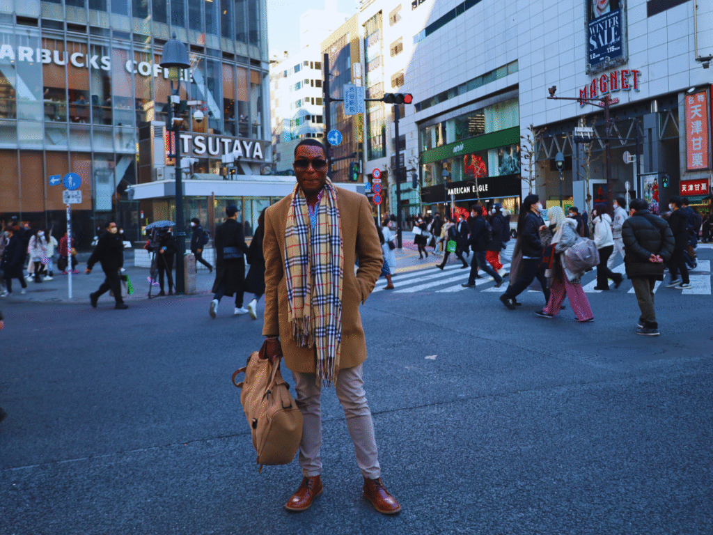 Photo of a man standing in Tokyo shopping for a Ginza area guide