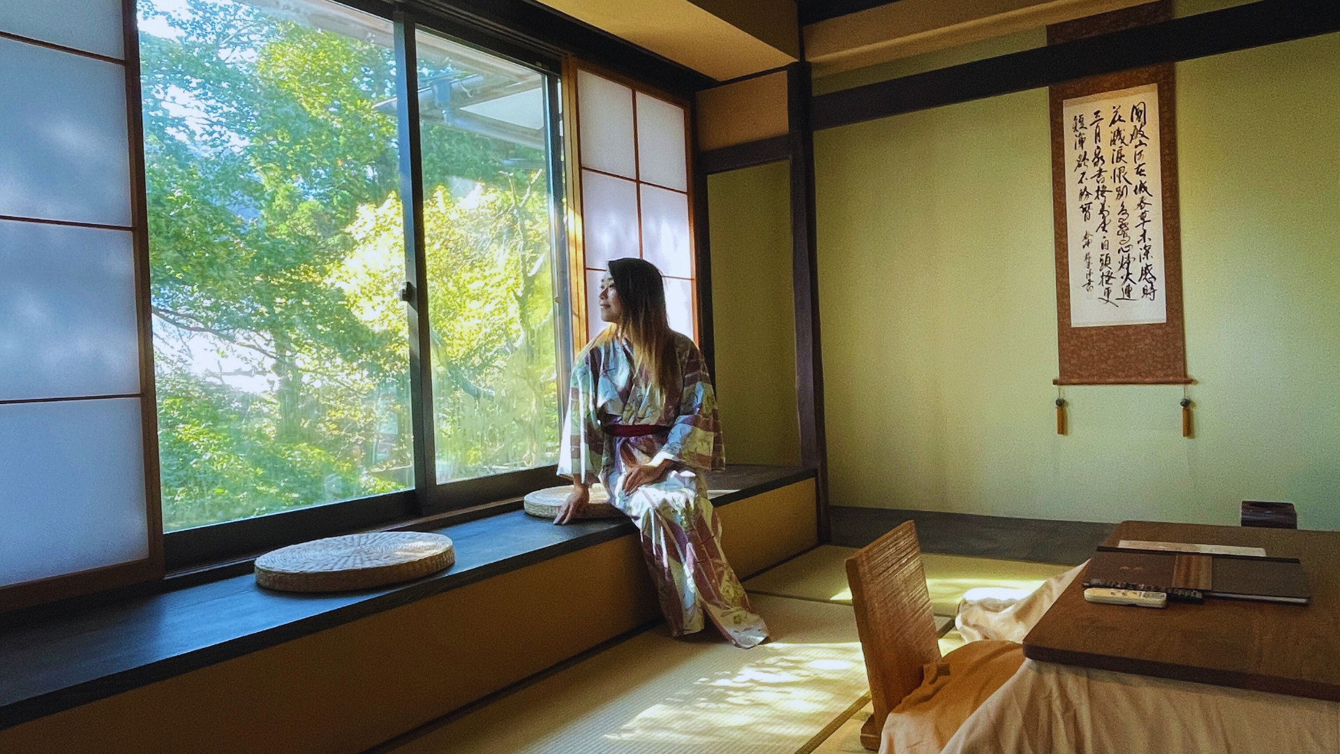 Flip Japan what is a ryokan photo of a woman in a ryokan room demonstrating ryokan etiquette