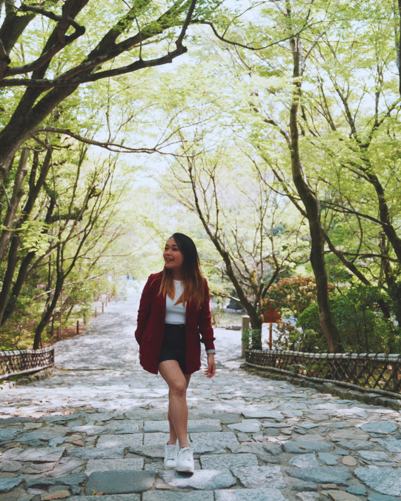 Flip Japan photo of a woman walking up the steps at Saihoji in Kyoto for Osaka vs Tokyo