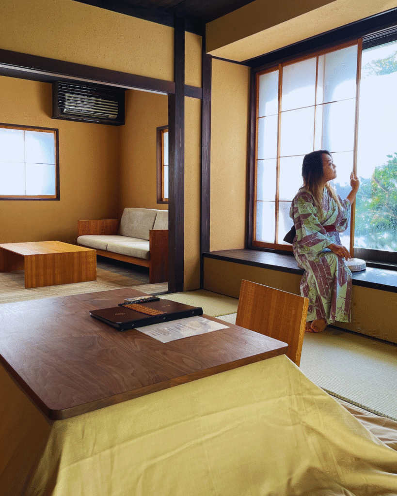 Flip Japan photo of a woman wearing yukata sitting in a ryokan window as dos of Japanese culture