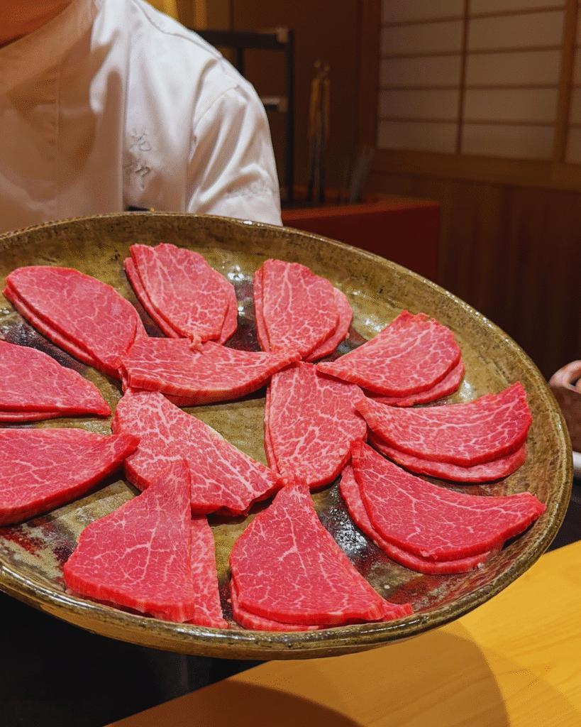 Flip Japan photo of a plate of thinly sliced Japanese beef in foodie Japan