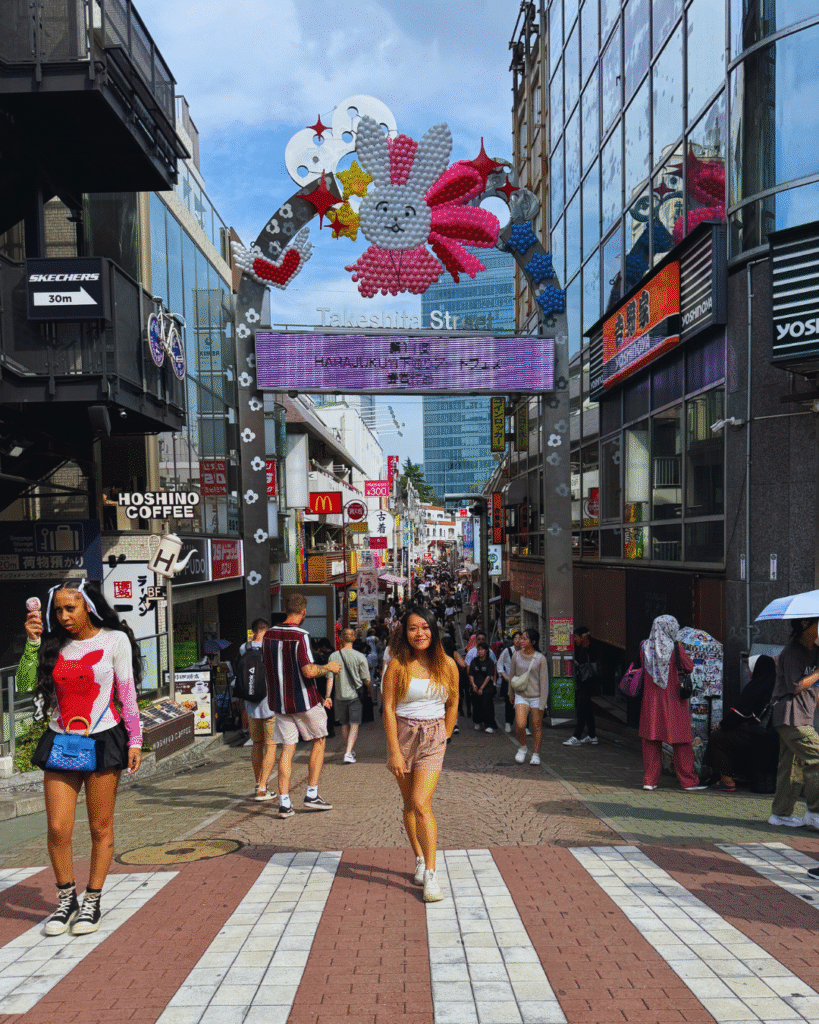 Flip Japan photo of a woman standing in front of Takeshita Street in Harajuku for a 5 day Tokyo itinerary