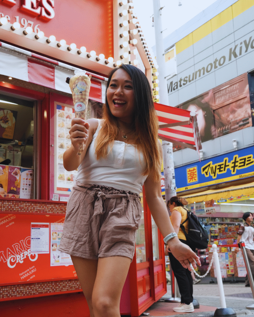 Flip Japan photo of a woman eating a crepe in Harajuku for a 5 day Tokyo itinerary