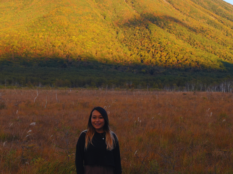Flip Japan photo of a woman standing in front of a mountain in Senjogahara Marshland in Nikko
