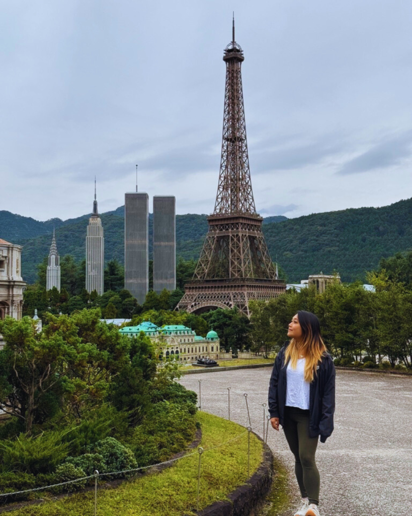 Flip Japan photo of Venese looking up at the mini Eiffel Tower in Tobu World Square, Nikko