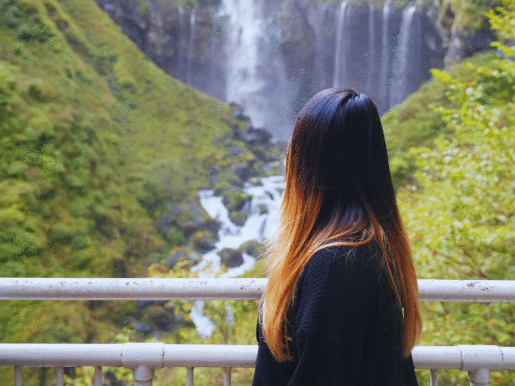 Flip Japan Nikko Area Guide: Kegon Falls Flip Japan photo of a woman looking at Kegon Falls in Nikko