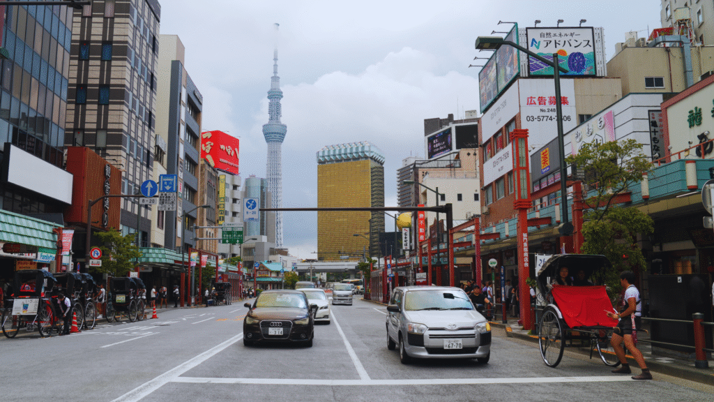 Flip Japan Complete Tokyo Bucket List Flip Japan photo of a street in Asakusa in Tokyo with Tokyo Skytree in the background