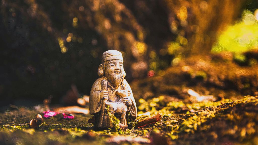 Photo of a small stone buddha on the forest ground in Gunma prefecture, Japan