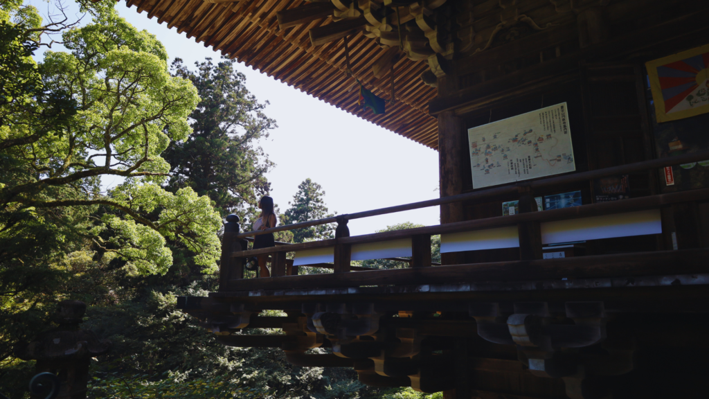 Flip Japan photo of Venese standing on the wooden terrace of the maniden at Engyo Ji