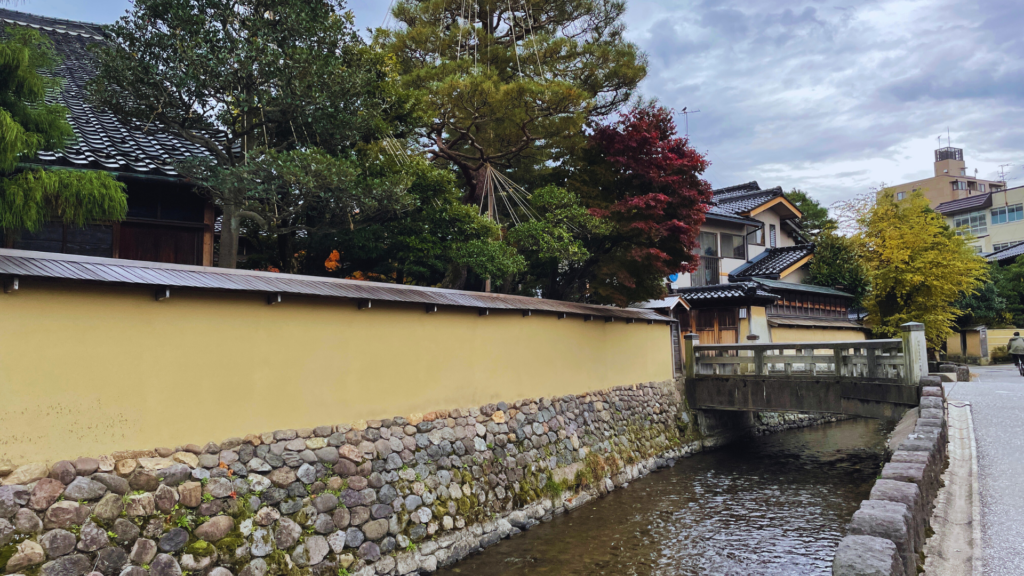 Flip Japan photo of a stone walkway and bridge in Kanazawa