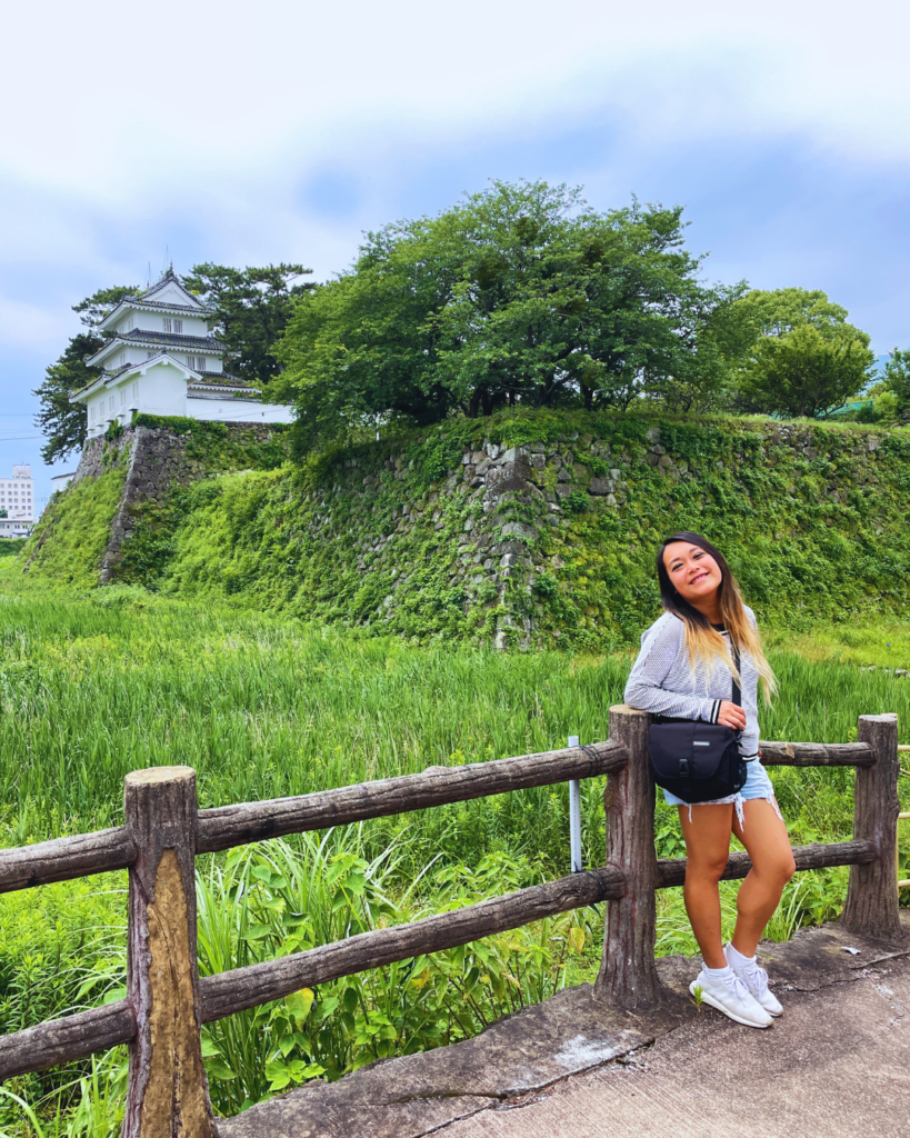 Flip Japan photo of Venese standing in front of the Shimabara Peninsula in Nagasaki Prefecture