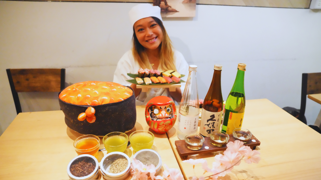 Flip Japan photo of Venese holding a plate of handmade sushi