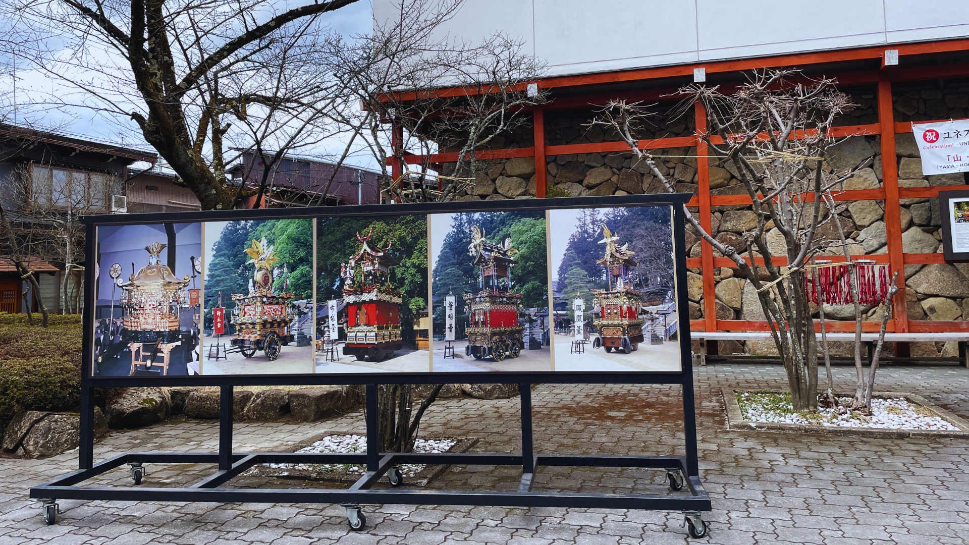 Flip Japan photo of the posters of Takayama Festival exhibition floats outside of Sakurayama Hachimangu Shrine