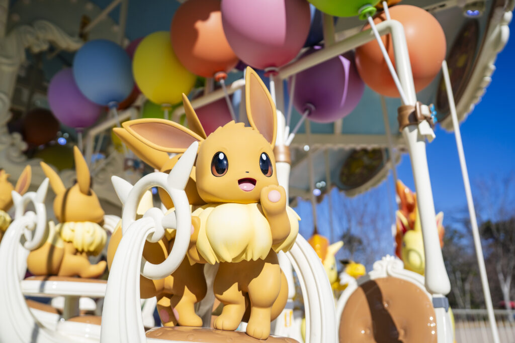 Photo of an Evee on the Vee Vee Voyage carousel in PokéPark Kanto