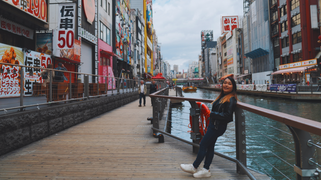 Flip Japan photo of Venese standing in front of the Dotonbori canal