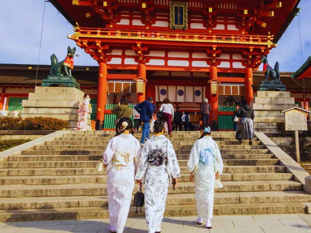 Large crowds of tourists visiting the torii gates of Fushimi Inari Shrine in Kyoto during the busy Japan's Golden Week holiday period