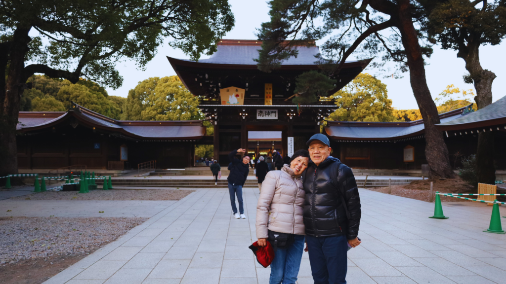 Flip Japan photo of a senior couple posing outside of meiji jingu in Tokyo