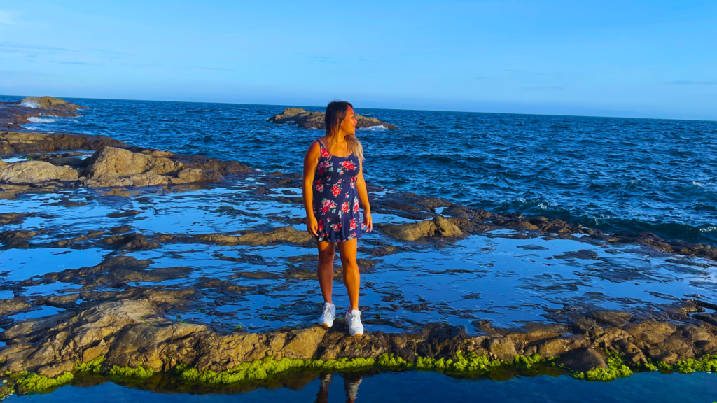 Flip Japan photo of Venese standing in the rock pools by Enoshima on a sunny day