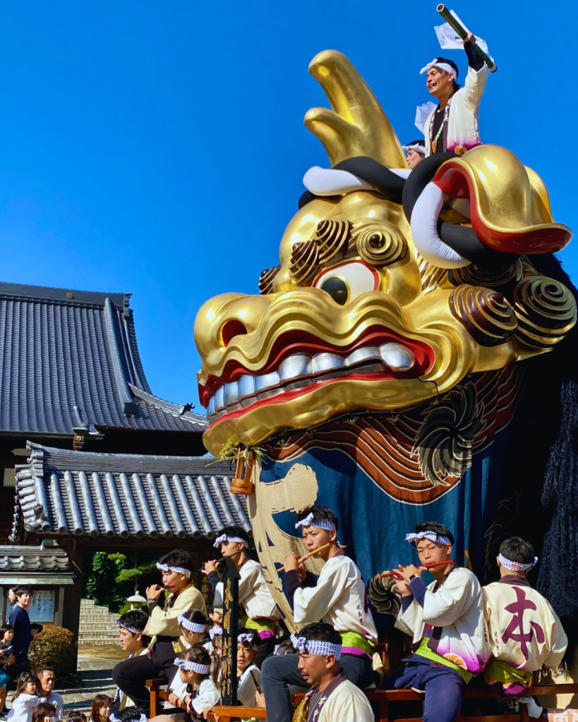 A photo of a golden dragon float at Karatsu Kunchi in Kyushu