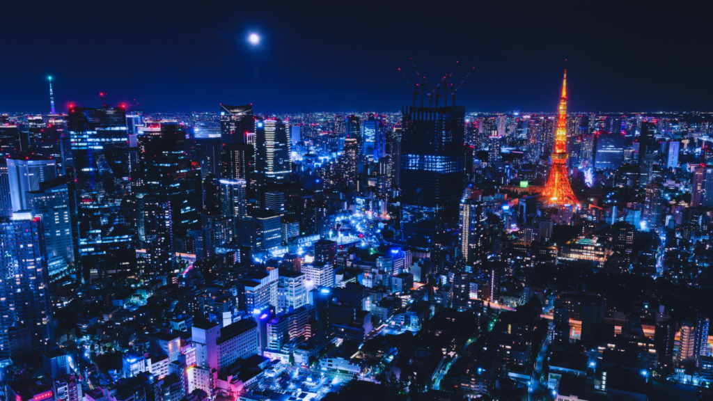 Photo of the Tokyo skylight at night with a full moon